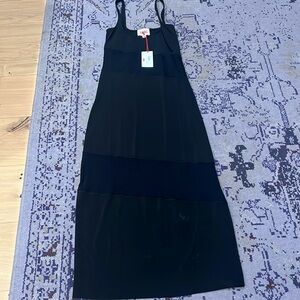 Solid and striped black dress or cover up with sheet areas